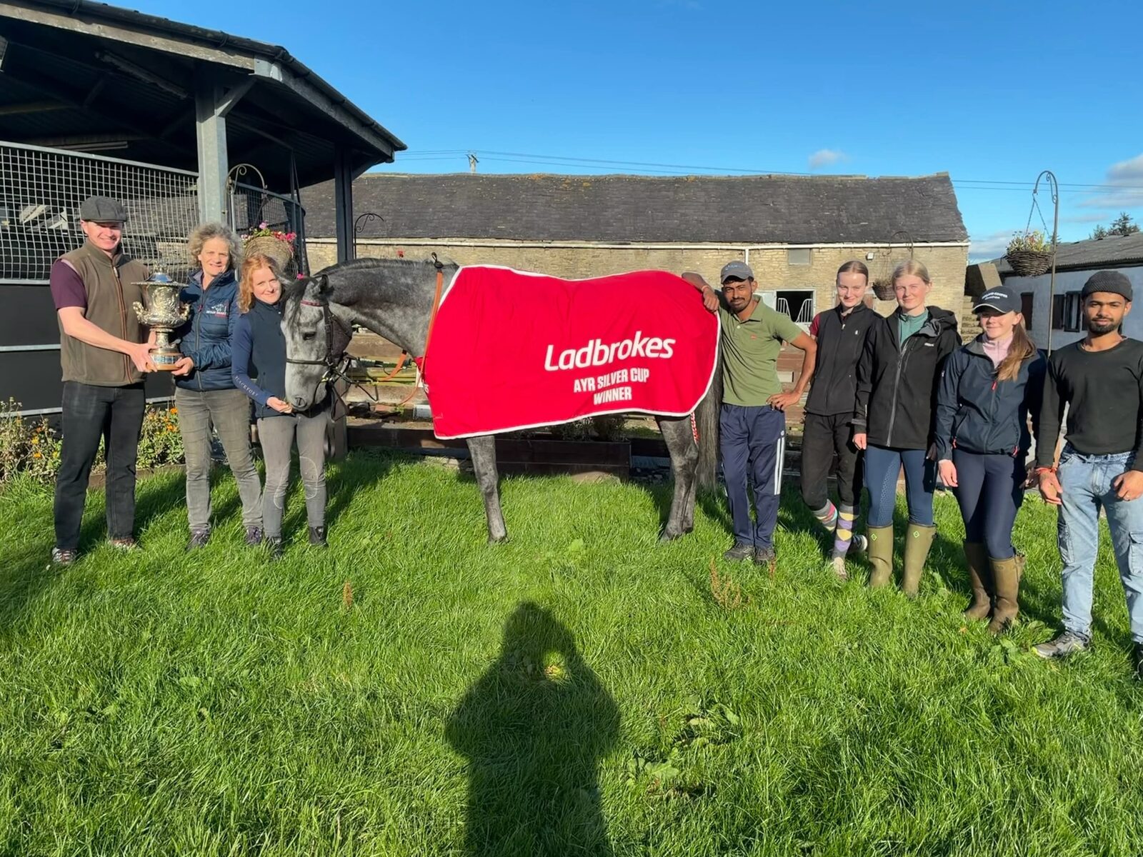 Bryan and Beth Smart with Station X and the Silver Cup trophy at the Hambleton House yard.