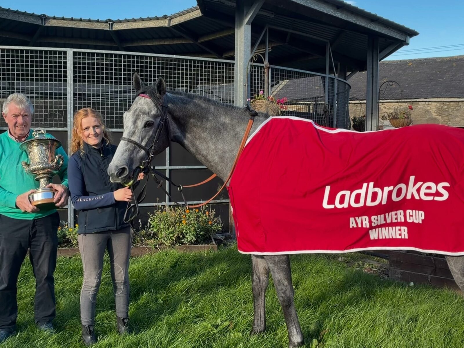 Bryan Smart with Station X and the Silver Cup trophy at the Hambleton House yard.